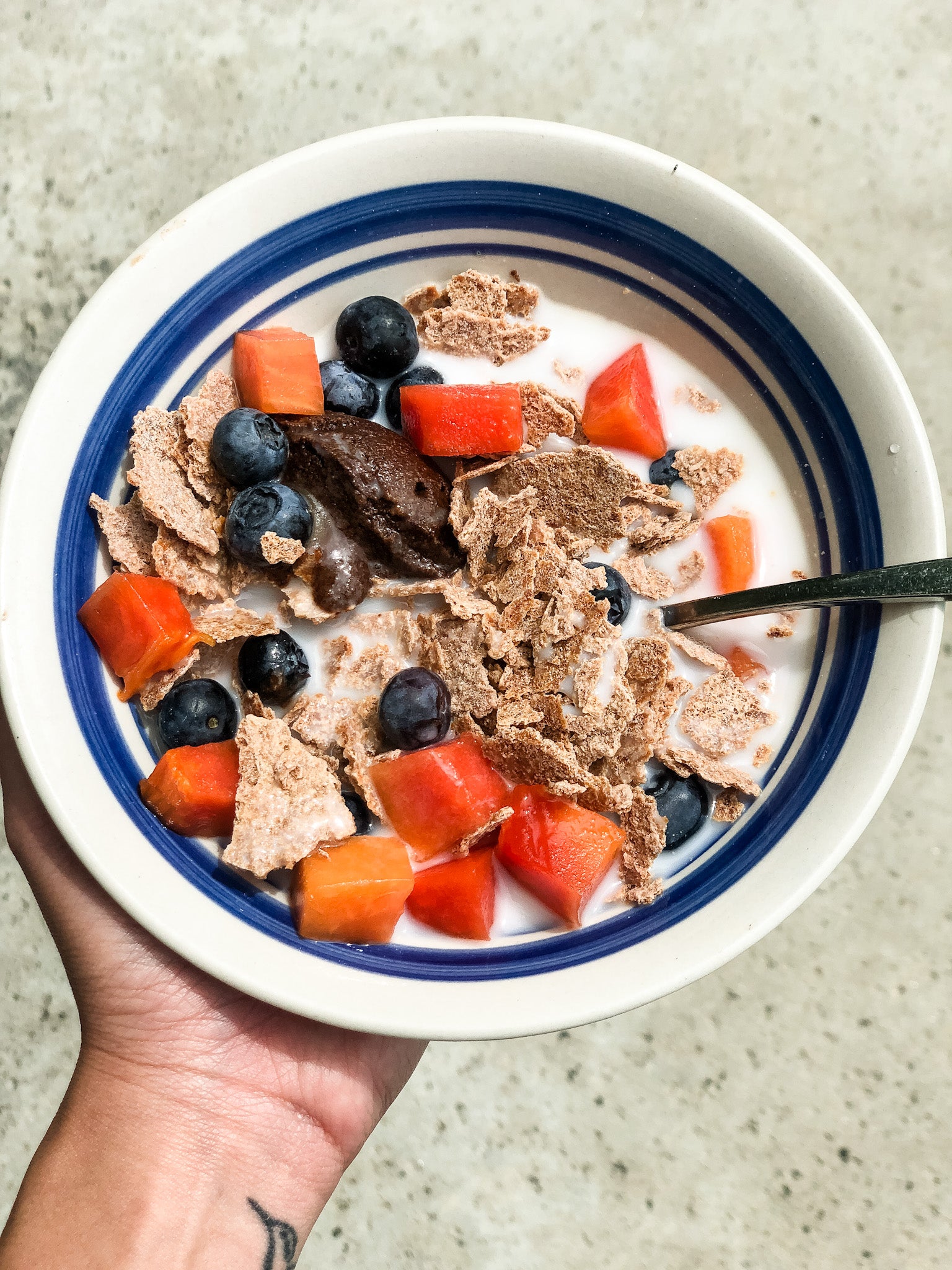 A bowl of NUCO Coconut Crunch cereal, up close
